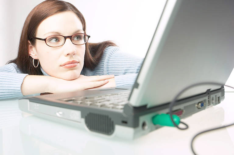 Woman using watching laptop computer screen