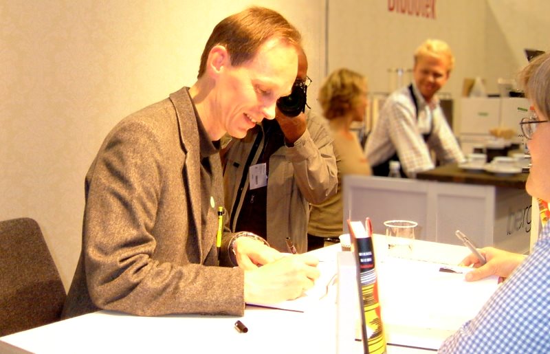 mikael niemi, author, book signing at a book show