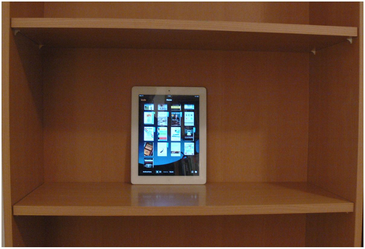 ipad tablet in a bookshelf