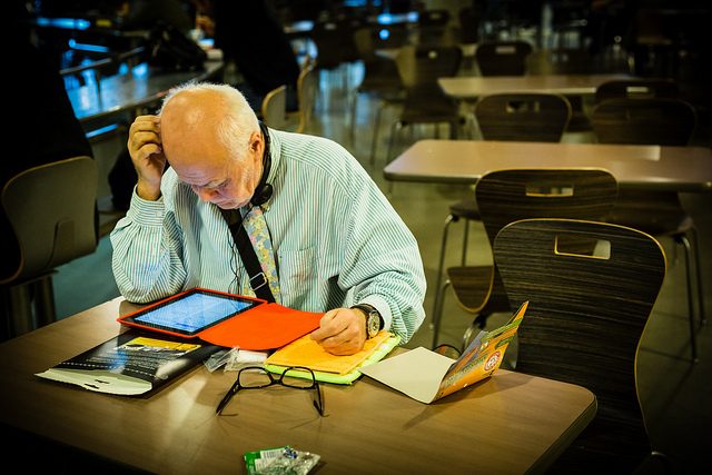 tablet, old man reading by Kat Northern Lights Man