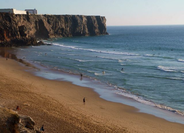 Surfers in Sagres, Algarve, Portugal.