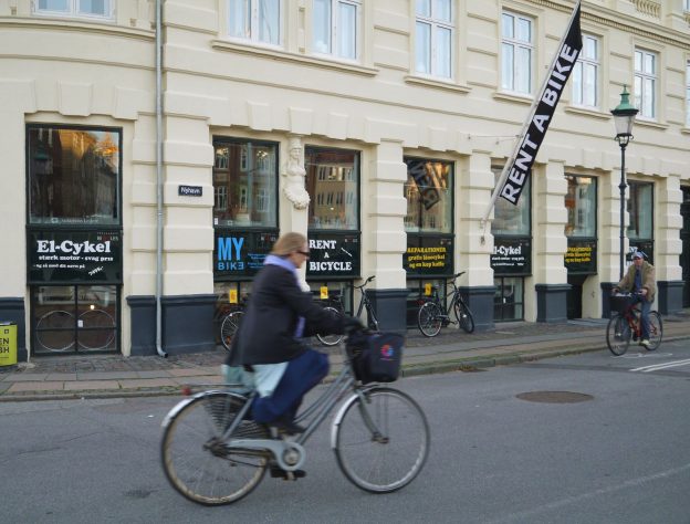 Copenhagen, Denmark: cyclists in front of bicycle rental shop in the city center