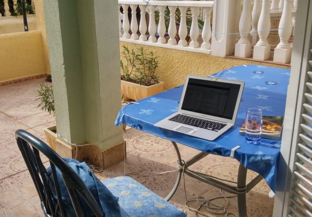 digital nomad's office on an outdoor terrace in Italy