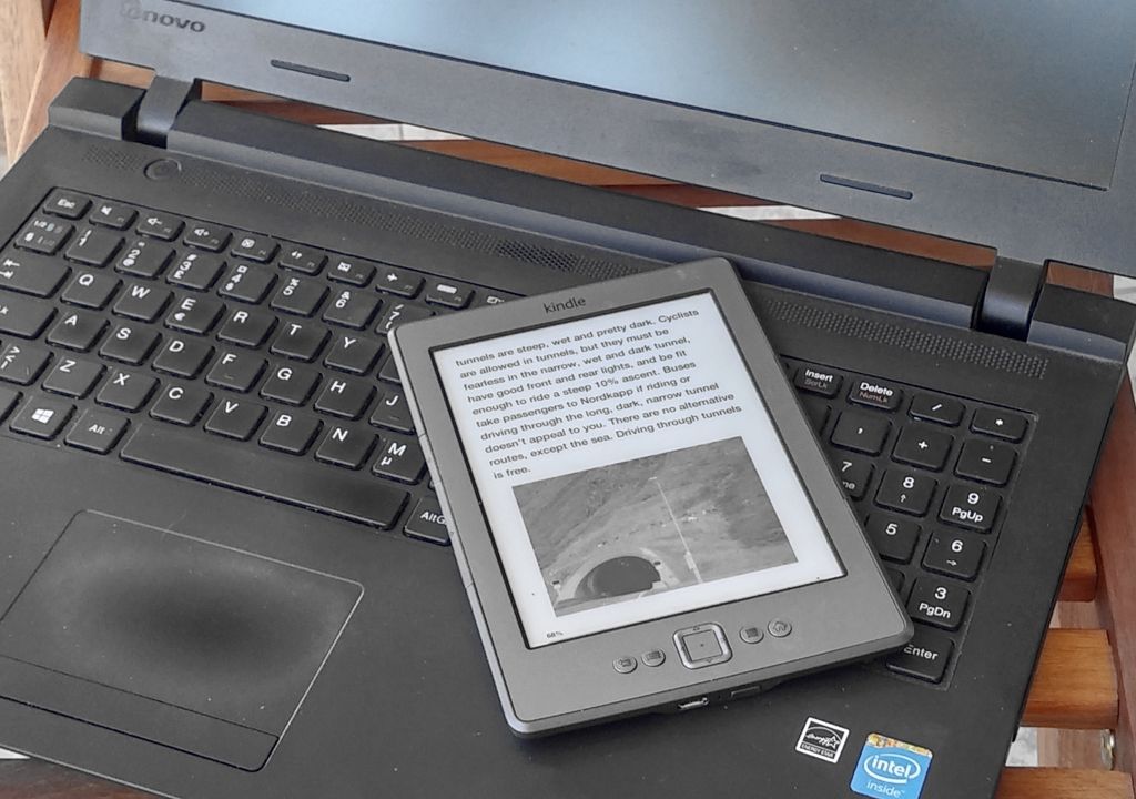 Amazon Kindle ereader on laptop keyboard