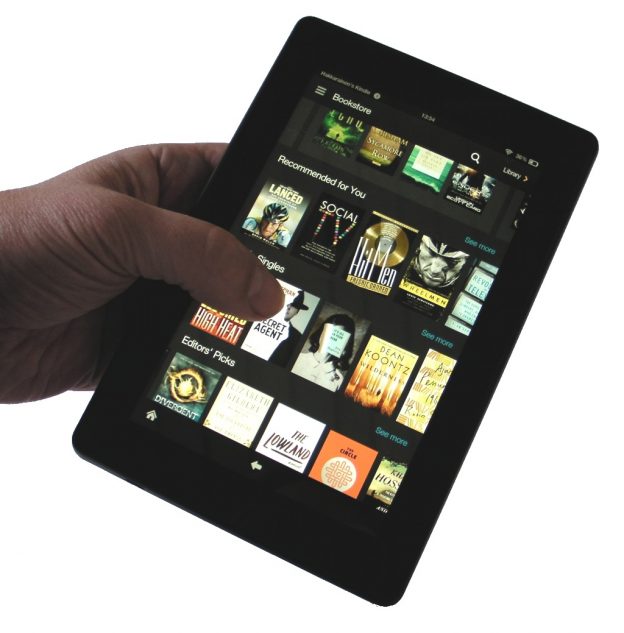 Amazon Fire tablet in hand