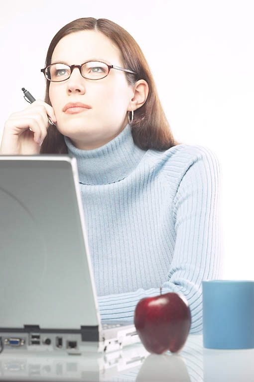 woman thinking what to write, laptop, pen, apple on desk