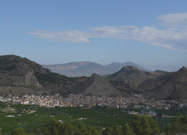 an ancient european village at the foot of mountains