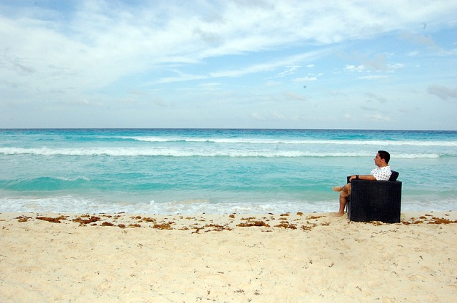 man sitting in chair at a beach. photo vic padilla.