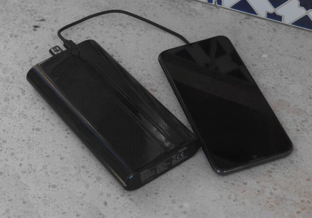 medium size power bank and modern phone