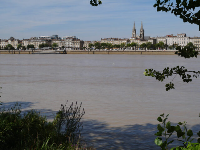 bordeaux city silhuette on the other side of river.