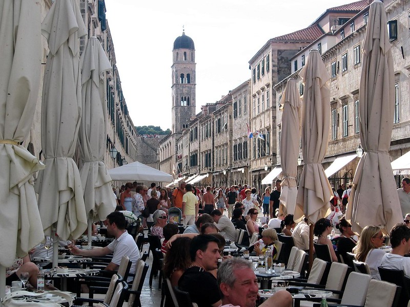 a street with outdoor restaurants in dubrovnik. photo by pululante on flickr.