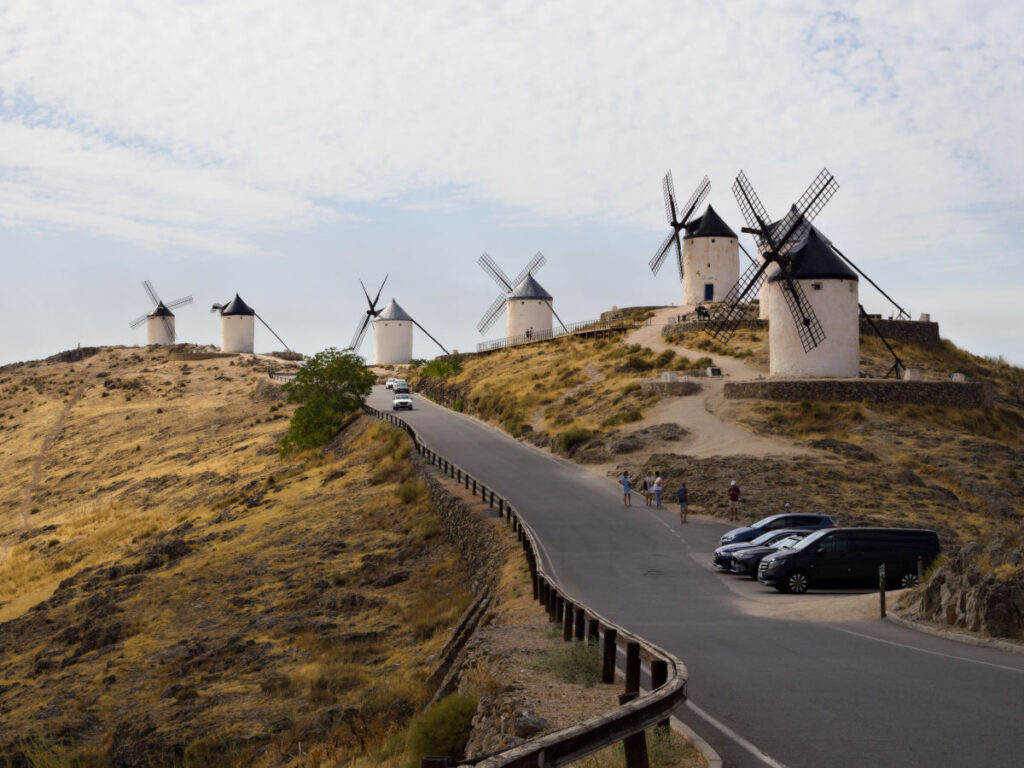 ancient white windmills in consuegra, spain. photo by arihak.